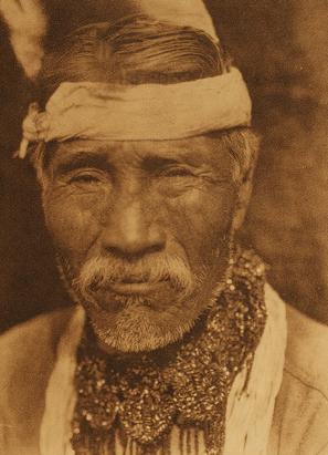 Photo of a Tolowa man by John Curtis, 1923.